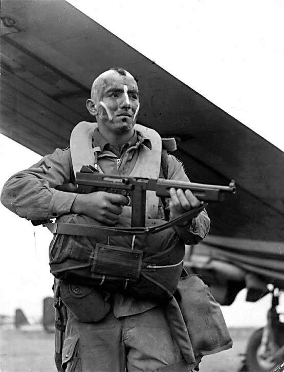 Sergeant Jake McNiece of HQ Company, 506th Parachute Infantry Regiment, holding a Thompson submachine gun
